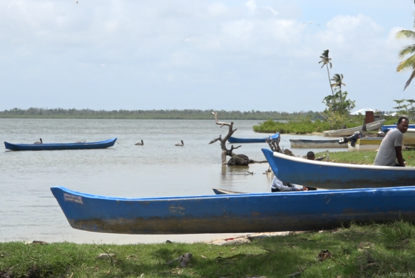 man with canoes on lake
