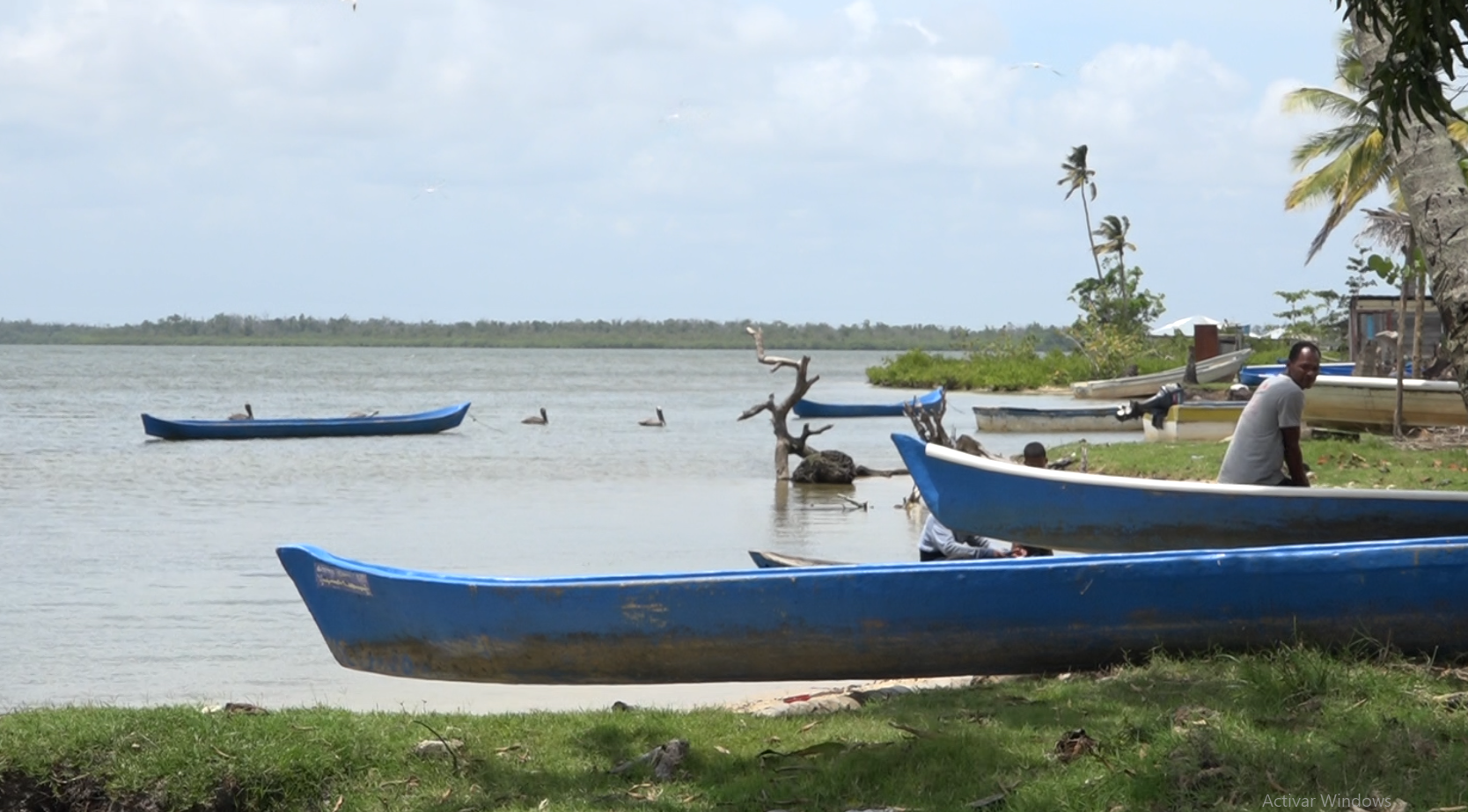 man with canoes on lake